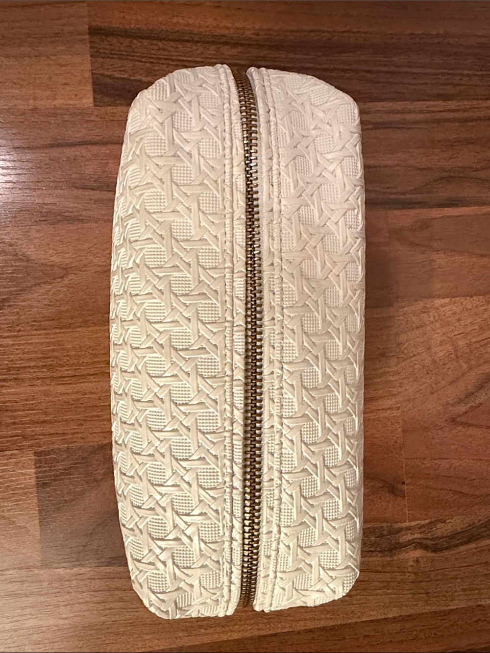 Tory Burch small cream colored cosmetic bag